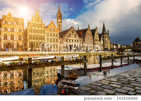 Ghent city historical center, tourists boats and colorful buildings on Leie river bank, Belgium Ghent city historical center, tourists boats and colorful buildings on Leie river bank, Belgium 141656980