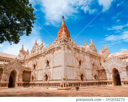 Ananda Temple in Bagan Myanmar with golden spires and traditional Mon style Buddhist architecture on the temple plain Ananda Temple in Bagan Myanmar with golden spires and traditional Mon style Buddhist architecture on the temple plain 141658273