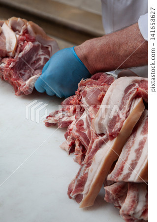 Preparing the meat on the butcher's block 141658627
