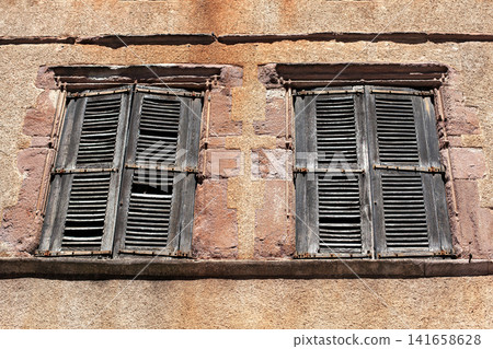 Deteriorated facade of a house in a village in the south of France Deteriorated facade of a house in a village in the south of France 141658628