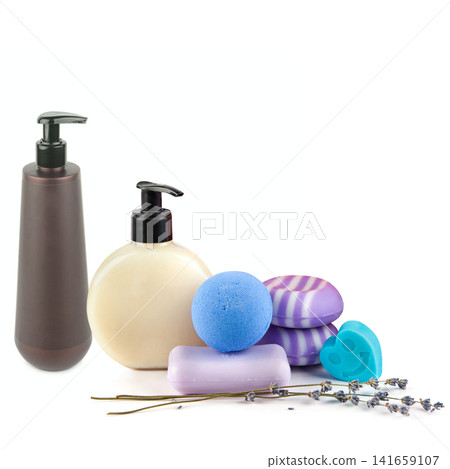 Natural bath products set with soap bars, lotion dispensers, and bath bomb isolated on white. Spa and body care cosmetics with lavender sprigs and copy space on white background. Natural bath products set with soap bars, lotion dispensers, and bath bomb isolated on white. Spa and body care cosmetics with lavender sprigs and copy space on white background. 141659107