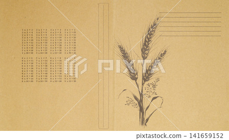 vintage notebook cover featuring wheat ears illustration and multiplication table on beige paperboard vintage notebook cover featuring wheat ears illustration and multiplication table on beige paperboard 141659152