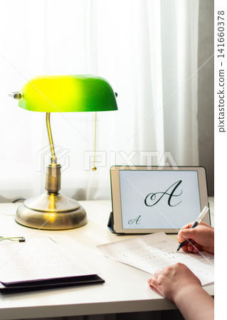 Woman sitting at desk and writing with pen. Handwriting boosts memory retention concept. Close up of pen on paper, deep concentration, analog study habits for better learning Woman sitting at desk and writing with pen. Handwriting boosts memory retention concept. Close up of pen on paper, deep concentration, analog study habits for better learning 141660378