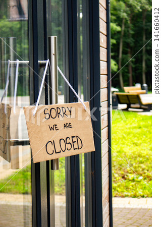 SORRY WE ARE CLOSED sign on entrance door. Online markets kill small business. Entrepreneurs forced to close after years of hard work. Financial debt concept SORRY WE ARE CLOSED sign on entrance door. Online markets kill small business. Entrepreneurs forced to close after years of hard work. Financial debt concept 141660412
