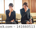 A woman in mourning clothes with tears in her eyes A woman in mourning clothes with tears in her eyes 141660513