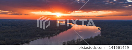 Aerial sunset over the Vistula River near Warsaw, dramatic clouds Aerial sunset over the Vistula River near Warsaw, dramatic clouds 141661439