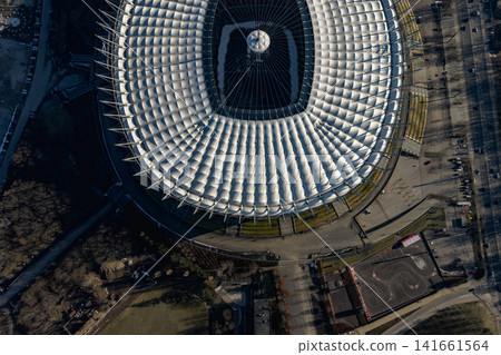 Aerial view of Warsaw PGE Narodowy roof with central mast symmetry Aerial view of Warsaw PGE Narodowy roof with central mast symmetry 141661564