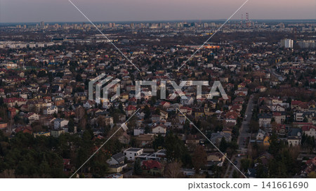 Aerial dusk view of Warsaw suburbia toward skyline and radio masts 141661690