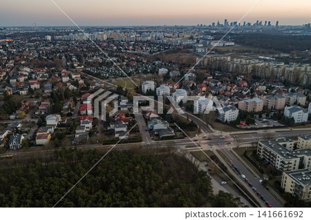 Aerial dusk view of Warsaw suburb with Kabaty forest and skyline 141661692