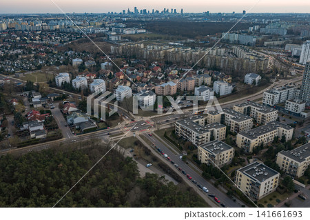 Aerial dusk view of Warsaw suburb with Palace of Culture on horizon 141661693