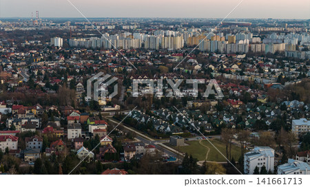 Aerial Warsaw suburb with homes and high rise blocks in late light Aerial Warsaw suburb with homes and high rise blocks in late light 141661713
