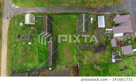 Vertical aerial view of Belarusian dacha village plots in autumn Vertical aerial view of Belarusian dacha village plots in autumn 141661731