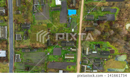 Aerial winter view of Belarusian dacha gardens with blue roof landmark Aerial winter view of Belarusian dacha gardens with blue roof landmark 141661734