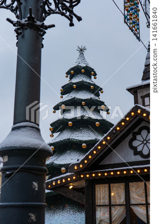 Snow dusted Christmas tree and market stall in Wroclaw Old Town 141661840