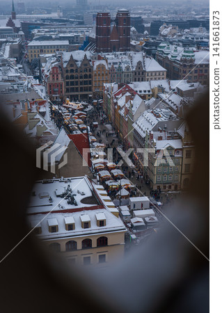 Aerial winter view of Wroclaw Rynek with St. Mary Magdalene towers Aerial winter view of Wroclaw Rynek with St. Mary Magdalene towers 141661873