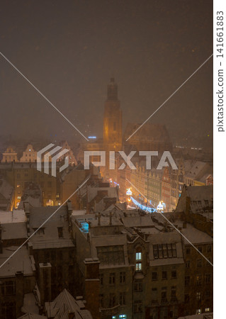 Snowy night over Wroclaw Old Town and St. Elizabeth's Church tower Snowy night over Wroclaw Old Town and St. Elizabeth's Church tower 141661883