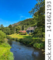 Wupper river with traditional slate farmhouse and forested hills near Beyenburg, Wuppertal, Germany 141662193
