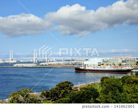 A view of ships anchored in Yokohama Port and the Yokohama Bay Bridge. A view of ships anchored in Yokohama Port and the Yokohama Bay Bridge. 141662801