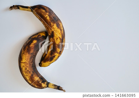 Two Overripe Bananas on White Background Two Overripe Bananas on White Background 141663095