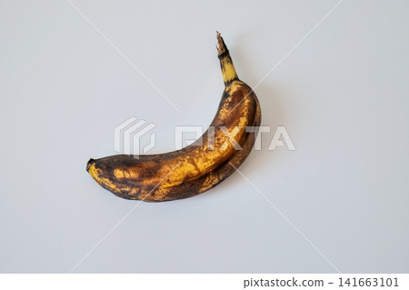 Single Overripe Banana on White Background Single Overripe Banana on White Background 141663101
