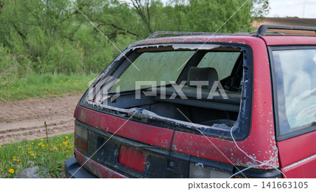 Abandoned Car with Broken Rear Window Abandoned Car with Broken Rear Window 141663105