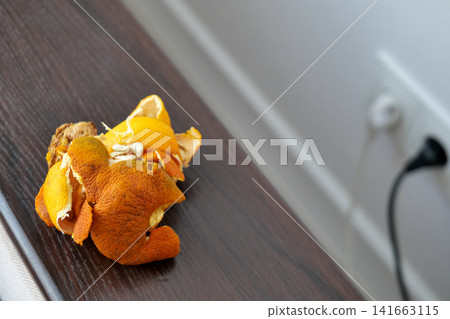 Peeling a Mandarin Peeling a Mandarin 141663115