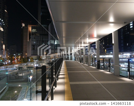 A pedestrian overpass near the Sakurabashi exit of Osaka Station at night, completely deserted. 141663118