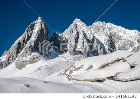 Scenery view of Jade Dragon Snow Mountain (or Mt.Yulong) in Yulong Naxi Autonomous County, Lijiang, in Yunnan province, China. Scenery view of Jade Dragon Snow Mountain (or Mt.Yulong) in Yulong Naxi Autonomous County, Lijiang, in Yunnan province, China. 141663148