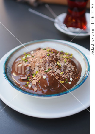 Chocolate dessert with toppings in a cafe Chocolate dessert with toppings in a cafe 141665170