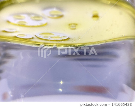 Close up view of oil and water separation with round bubbles chemistry scientific research fluid dynamics abstract background photo image visual element stock photography Close up view of oil and water separation with round bubbles chemistry scientific research fluid dynamics abstract background photo image visual element stock photography 141665428