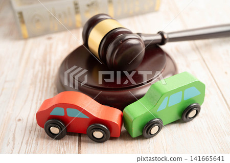 Car accident lawsuit and insurance, Judge hammer with car model. Car accident lawsuit and insurance, Judge hammer with car model. 141665641
