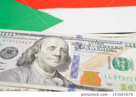 Sudan flag with US dollar banknote, finance banking concept. Sudan flag with US dollar banknote, finance banking concept. 141665676