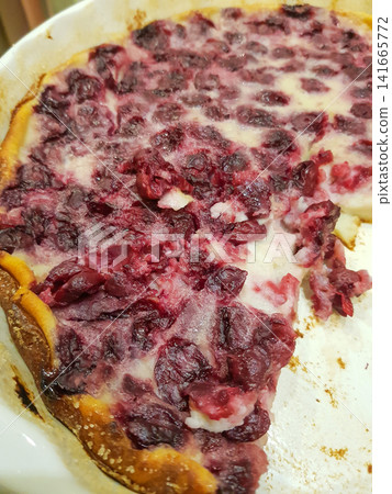 Baked cranberry pie with golden crust and filling, slice removed, served in white dish Baked cranberry pie with golden crust and filling, slice removed, served in white dish 141665772