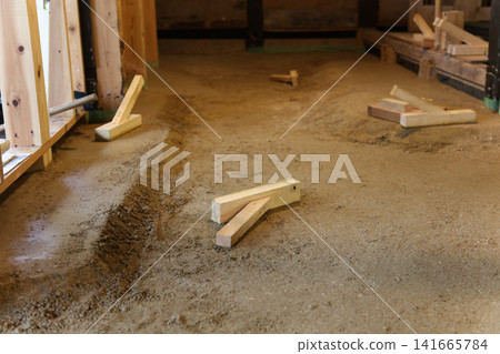 Preparing the earthen floor Preparing the earthen floor 141665784