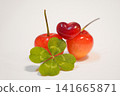 A lucky four-leaf clover and heart-shaped cherries 141665871