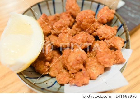 Crispy fried chicken cartilage - a popular snack at izakayas (Japanese pubs). Crispy fried chicken cartilage - a popular snack at izakayas (Japanese pubs). 141665956
