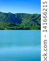 The beautiful scenery of the Sokohara Dam on Ishigaki Island, with its calm blue lake surface and deep green mountains. 141666215