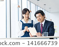 A businessman ordering at a cafe. Filming assistance provided by: Denpa Gakuen Educational Foundation, Tokyo Electronics College. 141666739