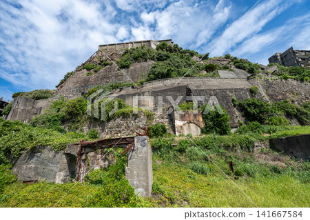 Concrete structures and retaining walls on the rocky slopes of Hashima Island Concrete structures and retaining walls on the rocky slopes of Hashima Island 141667584