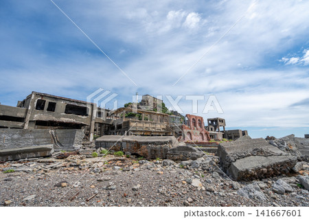 The ruins of the Gunkanjima coal mine office, where massive concrete blocks have collapsed and are lying scattered. The ruins of the Gunkanjima coal mine office, where massive concrete blocks have collapsed and are lying scattered. 141667601