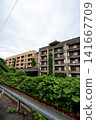 The abandoned apartment buildings on Ikeshima Island, seen through rusty guardrails. 141667709