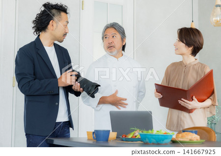 A team taking menu photos at a restaurant. A team taking menu photos at a restaurant. 141667925