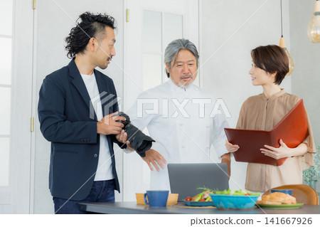 A team taking menu photos at a restaurant. A team taking menu photos at a restaurant. 141667926