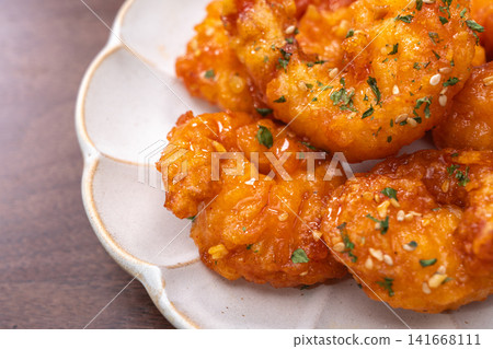 Crispy fried chili shrimp tossed in sweet and spicy sauce, Asian Chinese food style Crispy fried chili shrimp tossed in sweet and spicy sauce, Asian Chinese food style 141668111