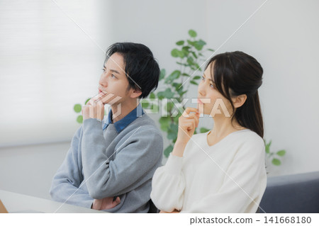 A young couple struggling with a computer problem. A young couple struggling with a computer problem. 141668180