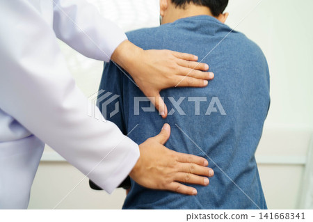 Physical therapy, Asian therapist doctor treat perform pain therapy in hospital. Physical therapy, Asian therapist doctor treat perform pain therapy in hospital. 141668341