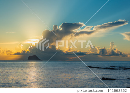 Beautiful Sunrise Over the Ocean in Wanli, Taiwan Beautiful Sunrise Over the Ocean in Wanli, Taiwan 141668862