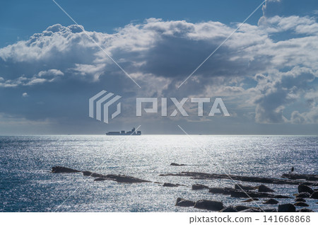 Cargo Ship on the Horizon in Taiwan Cargo Ship on the Horizon in Taiwan 141668868