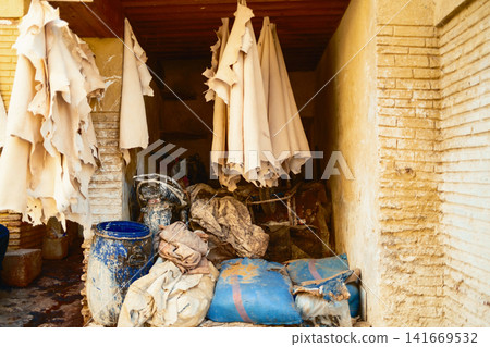 Traditional Moroccan tannery with hanging textiles Traditional Moroccan tannery with hanging textiles 141669532