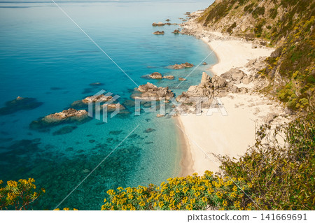 Rocky Seascape Framed By Green Cliffs Rocky Seascape Framed By Green Cliffs 141669691